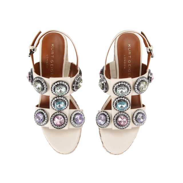 The Octavia Espadrille Wedge heel features a bone leather upper with large pastel crystals across the cage style upper. There is a rope effect to the wedge heel with pastel metallic thread running through. Heel height: 10.5cm.