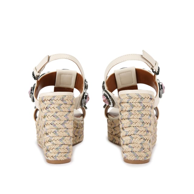 The Octavia Espadrille Wedge heel features a bone leather upper with large pastel crystals across the cage style upper. There is a rope effect to the wedge heel with pastel metallic thread running through. Heel height: 10.5cm.
