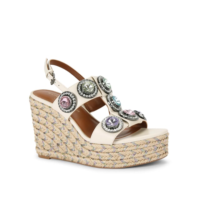 The Octavia Espadrille Wedge heel features a bone leather upper with large pastel crystals across the cage style upper. There is a rope effect to the wedge heel with pastel metallic thread running through. Heel height: 10.5cm.