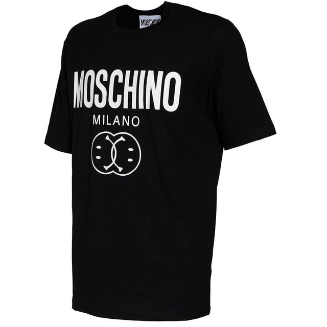 Elevate your casual wardrobe with the Moschino Bold Double Smiley Logo Black T-Shirt. Crafted from premium fabric, this tee offers exceptional comfort and durability for everyday wear. Its striking double smiley logo boldly expresses your playful style while maintaining a sleek, modern look. Perfect for pairing with jeans or layering under jackets, this versatile black t-shirt adds a touch of designer flair to any outfit. Make a confident statement effortlessly with Moschino's iconic design that blends fun and fashion seamlessly. Made in Portugal, 100% Cotton