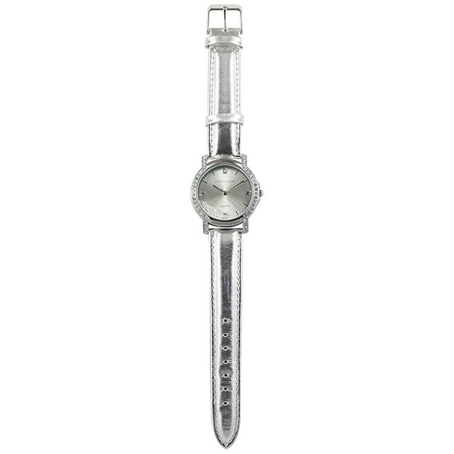 Devota & Lomba California Silver Watch: brilliant elegance with an urban soul.\n\n Designed for women who value refined style with modern touches, this watch dazzles with its metallic finish and the subtle dance of Swarovski crystals on its dial. A functional accessory with a sophisticated attitude.\n\n Details:\n - 30mm round steel case, surrounded by Swarovski crystals.\n - Minimalist dial with Swarovski crystals inside.\n - Japanese quartz movement PC32.\n - Genuine leather strap with silver metallic finish.\n - Water resistant up to 5 ATM.\n\n A feminine, functional, and characterful watch, perfect for elevating any look with a touch of sophistication.\n Measures: 35 mm\n Composition: Skin, Metal\n Care:\nAvoid contact with perfumes, creams or chemicals.