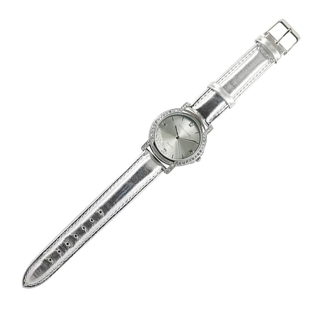 Devota & Lomba California Silver Watch: brilliant elegance with an urban soul.\n\n Designed for women who value refined style with modern touches, this watch dazzles with its metallic finish and the subtle dance of Swarovski crystals on its dial. A functional accessory with a sophisticated attitude.\n\n Details:\n - 30mm round steel case, surrounded by Swarovski crystals.\n - Minimalist dial with Swarovski crystals inside.\n - Japanese quartz movement PC32.\n - Genuine leather strap with silver metallic finish.\n - Water resistant up to 5 ATM.\n\n A feminine, functional, and characterful watch, perfect for elevating any look with a touch of sophistication.\n Measures: 35 mm\n Composition: Skin, Metal\n Care:\nAvoid contact with perfumes, creams or chemicals.