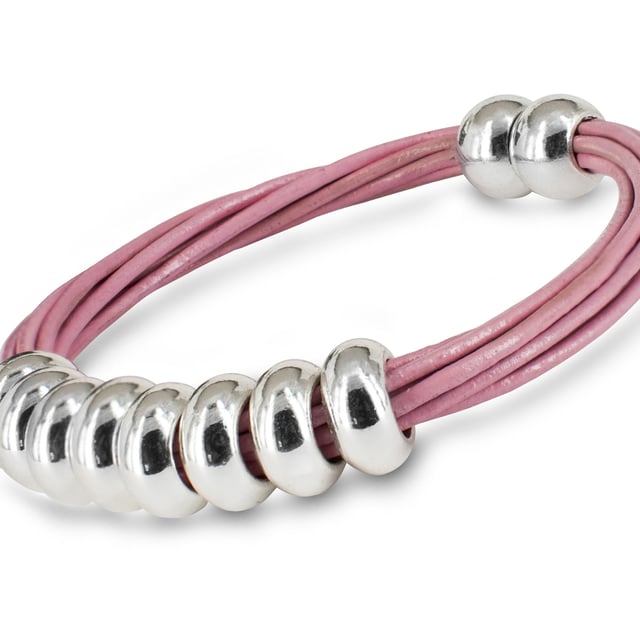 Sun Fun Bracelet – Modern contrast between natural texture and metallic shine.\n\n The Sun Fun bracelet combines the softness of leather with the shine of rhodium-plated metal for a casual, feminine, and versatile look. A casual piece of jewelry with a contemporary style, perfect for everyday wear.\n\n Details:\n\n - Made with strips of dyed natural leather, durable and soft to the touch.\n - Decorative rhodium-plated metal hoops with a shiny finish and minimalist design.\n - Multi-thread design that provides visual volume and a modern touch.\n - Integrated magnetic closure, practical and secure, easy to fit.\n\n A fresh and youthful women's bracelet that combines noble materials with an urban-chic aesthetic. Ideal worn alone or layered with other bracelets, elevating any look with a subtle touch.\n Measures: Diameter: 70 mm\n Composition: Leather, Rhodium-plated metal\n Care:\nAvoid contact with water, perfumes or chemicals.