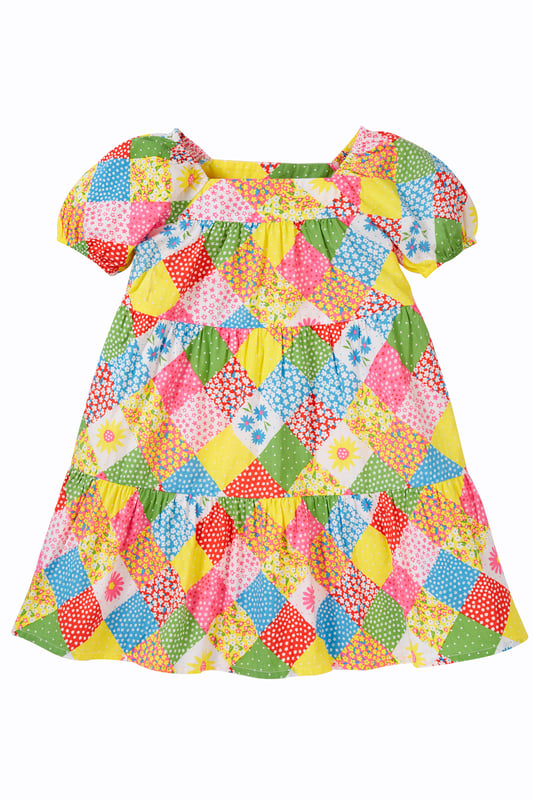 Short sleeved tiered dress made from Organic Cotton Poplin. Features soft elasticated gathered cuff.GOTS Organic Certified by Soil Association Certification Licence Number DK22283