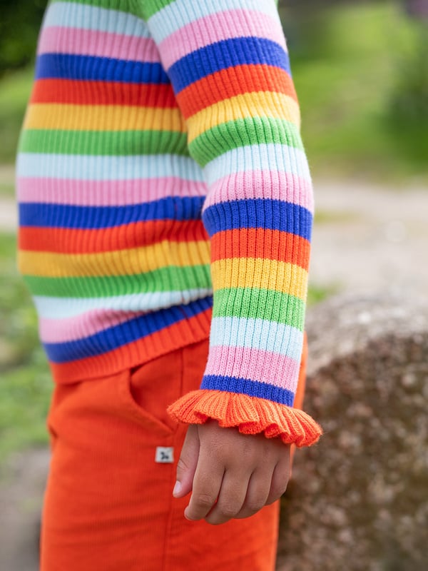 Organic cotton knitted rib jumper with lettuce finish at the sleeve. GOTS Organic Certified by Soil Association Certification Licence Number DK22283. Part of the Frugi circular Recycle Me! Range, this garment can be recycled once it comes to the end of it's usable life.
