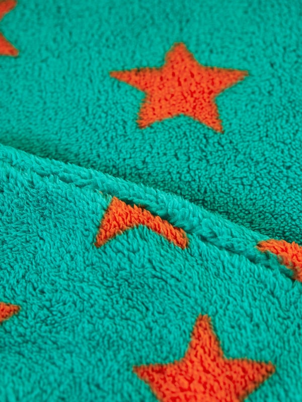 Super soft recycled polyester fleece made from recycled textiles, helping to divert end of life clothing and textiles from landfill. Features extended zip opening for easy dressing with protective zip guard. 3 piece panel hood construction for a comfortable fit. For sizes Newborn to 12 months there are fold over foot and hand fleece cuffs to help keep little feet and hands warm when out and about. Part of the Frugi circular Recycle Me! Range, this garment can be recycled once it comes to the end of it's usable life. Oeko-Tex standard 100 certified.