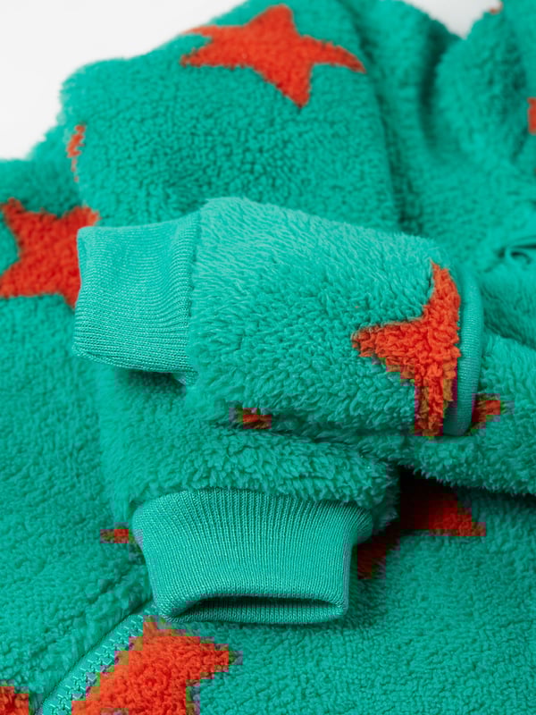 Super soft recycled polyester fleece made from recycled textiles, helping to divert end of life clothing and textiles from landfill. Features extended zip opening for easy dressing with protective zip guard. 3 piece panel hood construction for a comfortable fit. For sizes Newborn to 12 months there are fold over foot and hand fleece cuffs to help keep little feet and hands warm when out and about. Part of the Frugi circular Recycle Me! Range, this garment can be recycled once it comes to the end of it's usable life. Oeko-Tex standard 100 certified.