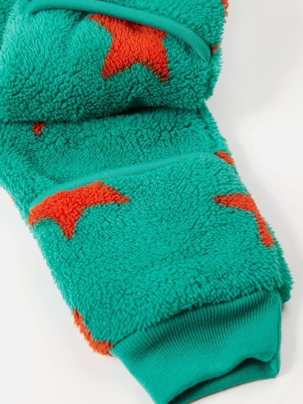 Super soft recycled polyester fleece made from recycled textiles, helping to divert end of life clothing and textiles from landfill. Features extended zip opening for easy dressing with protective zip guard. 3 piece panel hood construction for a comfortable fit. For sizes Newborn to 12 months there are fold over foot and hand fleece cuffs to help keep little feet and hands warm when out and about. Part of the Frugi circular Recycle Me! Range, this garment can be recycled once it comes to the end of it's usable life. Oeko-Tex standard 100 certified.