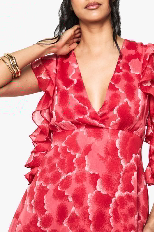 Flirty plunge neckline creates a striking focal point
        Delicate chiffon fabric with all-over floral pattern for a feminine touch
        Romantic ruffle detailing on the short sleeves adds movement and dimension
        Asymmetric hemline with lace trim creates visual interest
        Mini length silhouette perfect for showcasing your legs
    
    Make a statement at your next casual gathering in this enchanting chiffon mini dress from Boohoo. The eye-catching plunge neckline and fluttery ruffle sleeves create a playful yet sophisticated silhouette that's perfect for day-to-night transitions. The asymmetric hemline with delicate lace trim adds a contemporary twist to this feminine piece. Style with strappy sandals and minimal gold jewellery as seen on our model for family gatherings or weekend brunches. For cooler evenings, layer with a cropped denim jacket and ankle boots. This versatile dress works beautifully for garden parties, casual dates, or styled with trainers for a more relaxed daytime look. The lightweight chiffon fabric ensures comfort while maintaining that effortlessly chic aesthetic that's quintessentially Boohoo.