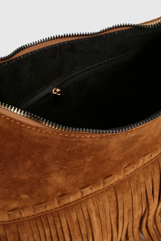 Striking fringe detail along the bottom edge creates movement and texture
        Faux suede finish offers a luxurious tactile experience
        Adjustable shoulder strap for versatile carrying options
        Spacious interior with secure zip closure
        Distinctive stitching detail adds artisanal character
    
    Channel your inner bohemian spirit with this fringed shoulder bag from Boohoo. The cascading fringe detail creates a playful sense of movement that transforms even the simplest outfit into a style statement. Perfect for casual daytime adventures, this bag pairs beautifully with floaty maxi dresses and ankle boots for festival outings, or team with straight-leg jeans and a crisp white blouse for weekend brunches. The adjustable strap allows for comfortable wear across the body or over the shoulder, adapting to your needs throughout the day. Spacious enough for your essentials yet compact enough to remain chic, this bag strikes the perfect balance between fashion and function. The faux suede texture adds a touch of tactile interest that complements both daytime casual and relaxed evening looks.