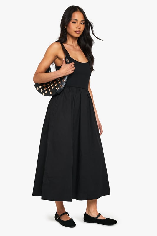 Flattering scoop neckline for a feminine touch
        Sleeveless design perfect for warmer days
        Fitted bodice with a flared skirt for a classic silhouette
        Midi length offers versatile styling options
        Soft cotton blend fabric ensures all-day comfort
    
    This charming jersey dress from Boohoo is the epitome of effortless style. The scoop neckline and sleeveless cut create a graceful look, while the fitted bodice smoothly transitions into a flared skirt, crafting a timeless silhouette. The midi length strikes the perfect balance between casual and chic, making it suitable for various occasions. Style it with flat sandals and a denim jacket for a relaxed daytime look, or dress it up with statement earrings and strappy heels for evening drinks. The versatile design allows for easy layering - throw on a cropped cardigan for cooler evenings or pair it with trainers for a trendy, laid-back vibe. This dress is a wardrobe essential that will take you from family gatherings to casual outings with friends, all while keeping you comfortable and stylish.