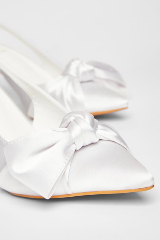 - Satin finish - Slingback strap - Bow detail - Pointed toe - Heel height: 9 cm / 3.5 inches approx - Excluding trims