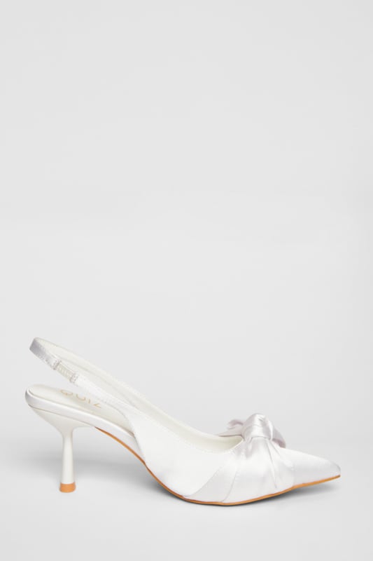 - Satin finish - Slingback strap - Bow detail - Pointed toe - Heel height: 9 cm / 3.5 inches approx - Excluding trims