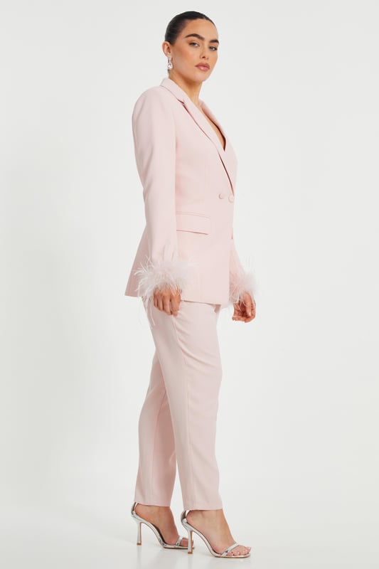 - Woven finish - Double breasted - Feather trim - Longline style - Model height: 5'2" - Model wears uk 6 / us 2 / eur 34 - Contains non-textile parts of animal origin - Always check the care wash label - Cool hand wash with mild detergent