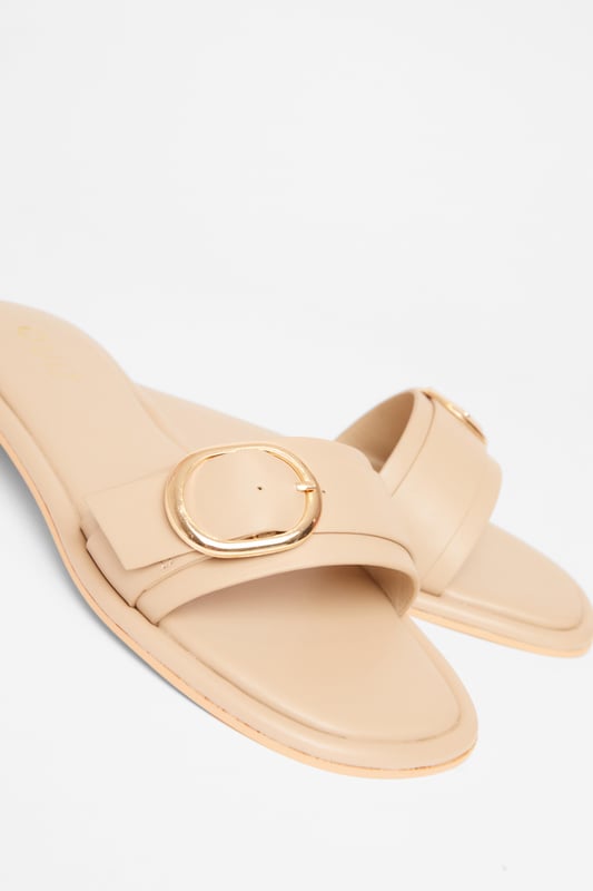 - Faux leather - Buckle detail - Flat sandals - Excluding trims