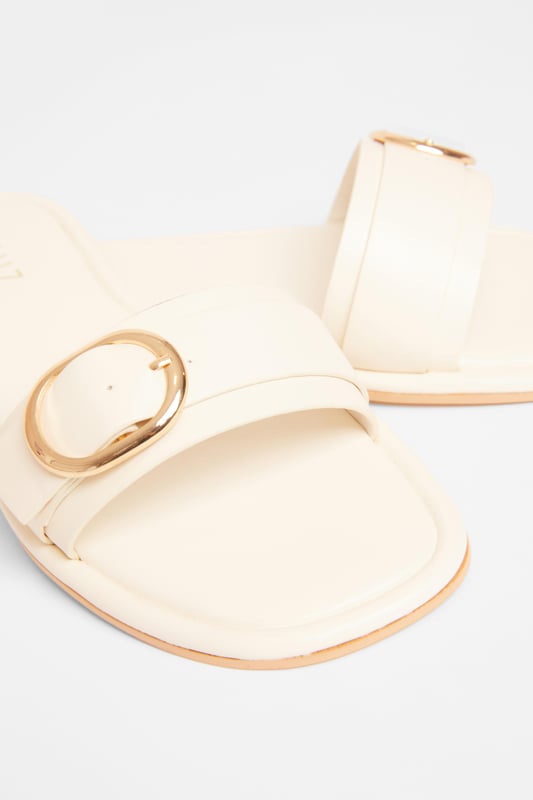 - Faux leather - Buckle detail - Flat sandals - Excluding trims