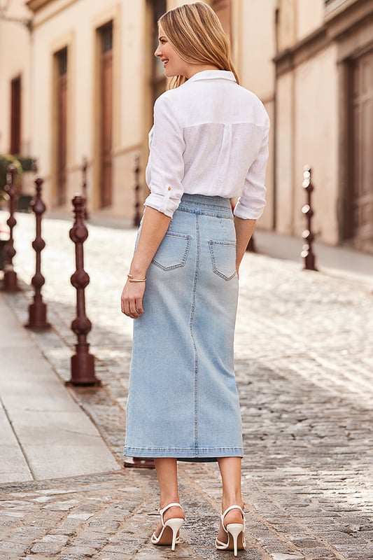 Add it to your denim line-upClever contouring waist with a statement double button detail to cinch you inCrafted from our signature soft stretch denim Sexy - and super-flattering - pencil silhouette Finished with a front split for effortless movementTuck in tees, camis, knits and going-out tops