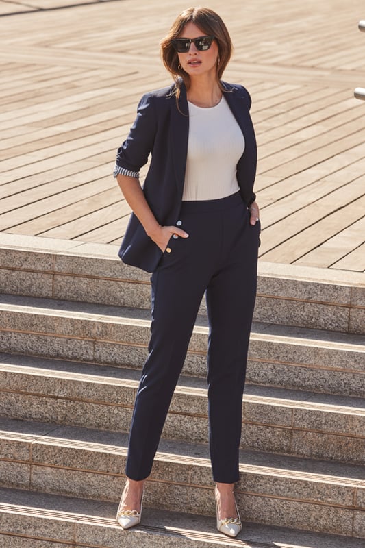 The secret to an effortlessly chic outfitCut in a timeless tapered silhouetteElevated with luxe gold buttonsNavy always looks stylishStyle with chic knits, silky blouses, simple tees and dressy topsCreate a sleek suit with the matching blazerInside leg to fit: Short 29" | Regular 31" | Long 33"