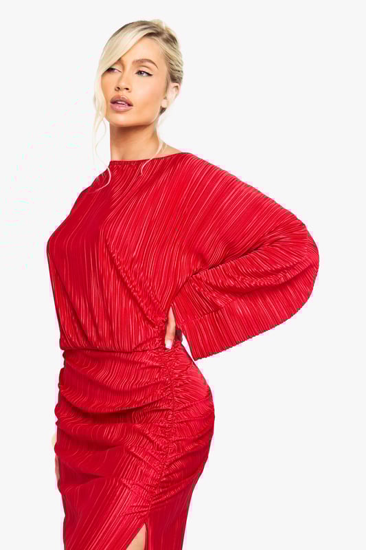Striking plisse textured maxi dress with dramatic side slit for movement
        Asymmetric sleeve design featuring one full-length and one short sleeve
        Flattering gathered waist detail that creates a blouson effect
        Elegant slash neckline that frames the dcolletage
        Floor-sweeping length with a figure-enhancing silhouette
    
    Make a statement entrance in this show-stopping plisse maxi dress from Boohoo. The distinctive asymmetric sleeve design creates a contemporary silhouette that demands attention, whilst the gathered waist detail cinches you in at just the right spot. The daring side slit adds a touch of allure and ensures ease of movement as you dance the night away. Style with strappy heels as shown and statement gold jewellery for maximum impact. Perfect for cocktail parties, evening soires or that special night out with the girls. The textured plisse fabric catches the light beautifully as you move, ensuring all eyes are on you. This versatile piece works brilliantly for those occasions when you want to combine comfort with head-turning style.