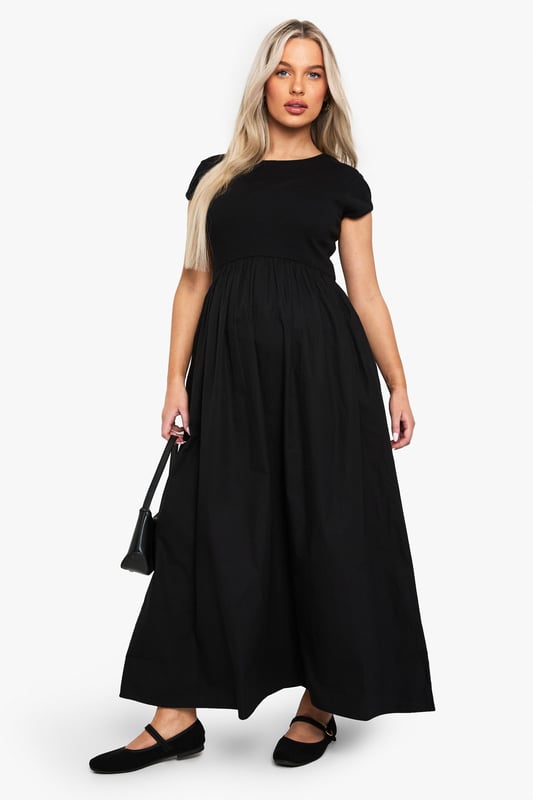 Ribbed jersey fabric for comfort and stretch
        Midi length for versatile styling
        Short sleeves for warm-weather wear
        Round neckline for a classic look
        Empire waistline to accommodate growing bump
    
    Embrace your changing silhouette with this chic and comfortable maternity midi dress from Boohoo. The ribbed jersey fabric offers a flattering fit that grows with you, while the empire waistline provides ample room for your blossoming bump. Perfect for casual outings or family gatherings, this dress can be easily dressed up or down. Pair it with flat sandals and a denim jacket for a relaxed daytime look, or add statement earrings and a clutch bag for an effortless evening ensemble. The versatile design ensures you'll feel confident and stylish throughout your pregnancy, making it a wardrobe staple for mums-to-be who don't want to compromise on fashion.