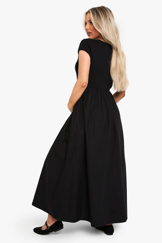 Ribbed jersey fabric for comfort and stretch
        Midi length for versatile styling
        Short sleeves for warm-weather wear
        Round neckline for a classic look
        Empire waistline to accommodate growing bump
    
    Embrace your changing silhouette with this chic and comfortable maternity midi dress from Boohoo. The ribbed jersey fabric offers a flattering fit that grows with you, while the empire waistline provides ample room for your blossoming bump. Perfect for casual outings or family gatherings, this dress can be easily dressed up or down. Pair it with flat sandals and a denim jacket for a relaxed daytime look, or add statement earrings and a clutch bag for an effortless evening ensemble. The versatile design ensures you'll feel confident and stylish throughout your pregnancy, making it a wardrobe staple for mums-to-be who don't want to compromise on fashion.