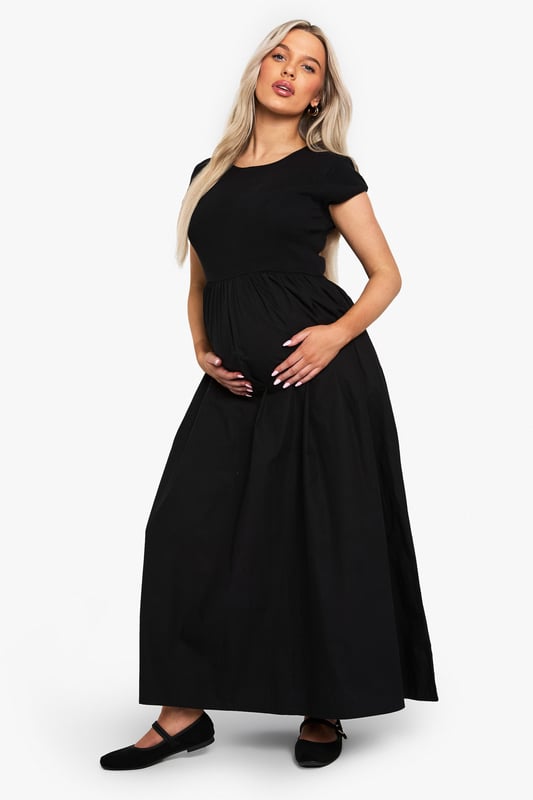Ribbed jersey fabric for comfort and stretch
        Midi length for versatile styling
        Short sleeves for warm-weather wear
        Round neckline for a classic look
        Empire waistline to accommodate growing bump
    
    Embrace your changing silhouette with this chic and comfortable maternity midi dress from Boohoo. The ribbed jersey fabric offers a flattering fit that grows with you, while the empire waistline provides ample room for your blossoming bump. Perfect for casual outings or family gatherings, this dress can be easily dressed up or down. Pair it with flat sandals and a denim jacket for a relaxed daytime look, or add statement earrings and a clutch bag for an effortless evening ensemble. The versatile design ensures you'll feel confident and stylish throughout your pregnancy, making it a wardrobe staple for mums-to-be who don't want to compromise on fashion.