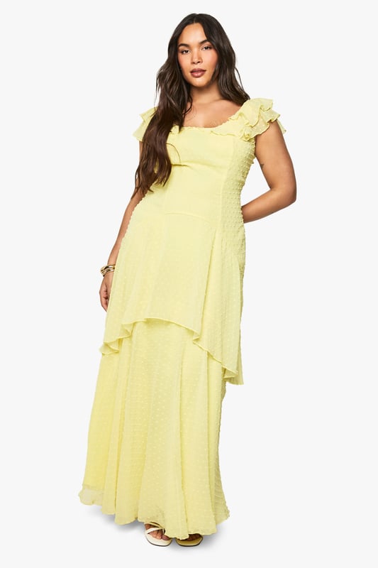 Plus dobby chiffon tiered maxi dress Textured dobby chiffon fabric with delicate dotted pattern throughout
Feminine cap sleeves with dainty ruffle trim detail
Elegant sweetheart neckline frames the dcolletage beautifully
Dramatic tiered design creates stunning movement and dimension
Floor-sweeping maxi length for a graceful silhouette
Make a statement at your next special occasion with this enchanting tiered maxi dress. The lightweight chiffon fabric creates an ethereal effect as you move, whilst the thoughtfully designed tiers add captivating volume and drama. Style with strappy metallic heels and a compact clutch as shown for formal events such as weddings or garden parties. For race day sophistication, pair with a fascinator and delicate jewellery. The versatile design works beautifully for graduations or evening soires when accessorised with bold cuffs and statement earrings. The inclusive plus sizing ensures a flattering fit that celebrates your curves, whilst the flowing silhouette offers both comfort and elegance throughout your special event. This Boohoo dress promises to be a cherished addition to your occasion wardrobe.