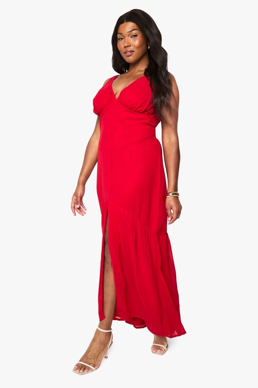 Flowing chiffon maxi dress with elegant patterned detailing
        Flattering V-neckline with gathered bust design
        Sleeveless silhouette with comfortable wide straps
        Dramatic front split for effortless movement
        Floor-sweeping length creates a graceful silhouette
    
    Make a striking impression at your next special occasion with this beautifully crafted chiffon maxi dress from Boohoo. The flowing fabric drapes elegantly around your curves, whilst the gathered bust and V-neckline create a feminine, flattering shape. The bold front split adds a touch of drama and allows for easy movement on the dance floor. Style with strappy metallic heels as shown and delicate gold jewellery to complete your look. Perfect for summer weddings, graduation ceremonies or race day events, this dress offers versatility and confidence in equal measure. The lightweight chiffon fabric ensures comfort throughout the day, whilst the patterned detailing adds visual interest to this showstopping piece. Accessorise with a small clutch bag and a sleek updo for maximum impact.