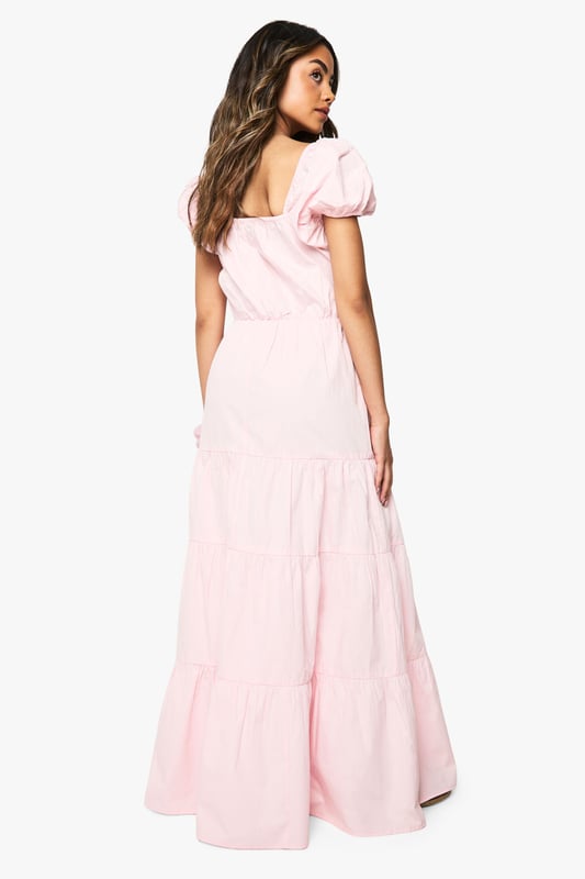 Cotton Poplin Tiered Maxi Dress Charming square neckline with delicate tie-front detail
Feminine puff sleeves for a romantic silhouette
Tiered maxi design creates beautiful movement and volume
Cotton poplin fabric offers breathable comfort for all-day wear
Flattering empire waistline that enhances your natural shape
This cotton poplin tiered maxi dress from Boohoo combines effortless style with day-long comfort. The dreamy silhouette features a square neckline and sweet puff sleeves that capture a romantic aesthetic perfect for summer days. Style with flat sandals and a woven tote for farmers' markets and brunch dates, or dress it up with espadrille wedges and statement earrings for garden parties and casual gatherings. The tiered design creates beautiful movement as you walk, while the breathable fabric keeps you cool during warmer weather. This versatile piece transitions seamlessly from daytime casual to evening relaxed events - simply switch your accessories to customise your look. Pair with a denim jacket for cooler evenings or wear alone to showcase the dress's beautiful structure and flow.