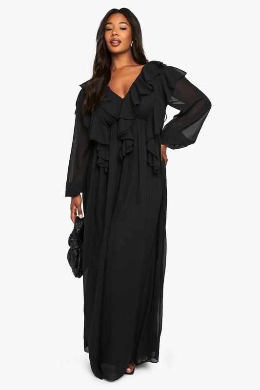 Flowing chiffon maxi-skater dress with dramatic ruffle detailing across the bodice
        Elegant V-neckline complemented by long, billowy sleeves for a romantic silhouette
        Flattering empire waistline that creates a feminine shape
        Striking open back design with delicate tie fastening
        Floor-sweeping length with gentle flare for graceful movement
    
    Make a captivating entrance at your next formal occasion in this enchanting chiffon maxi dress. The cascading ruffles create a sense of drama whilst the flowing skater silhouette ensures comfort throughout your event. Style with strappy heels and a compact clutch as seen on our model for a sophisticated evening ensemble. Perfect for weddings, formal dinners or graduation ceremonies, this dress offers versatility without compromising on elegance. The V-neckline frames the dcolletage beautifully, whilst the open back detail adds an unexpected twist to this otherwise classic piece. For cooler evenings, layer with a tailored blazer or delicate wrap to maintain the refined aesthetic whilst staying comfortable as you dance the night away.