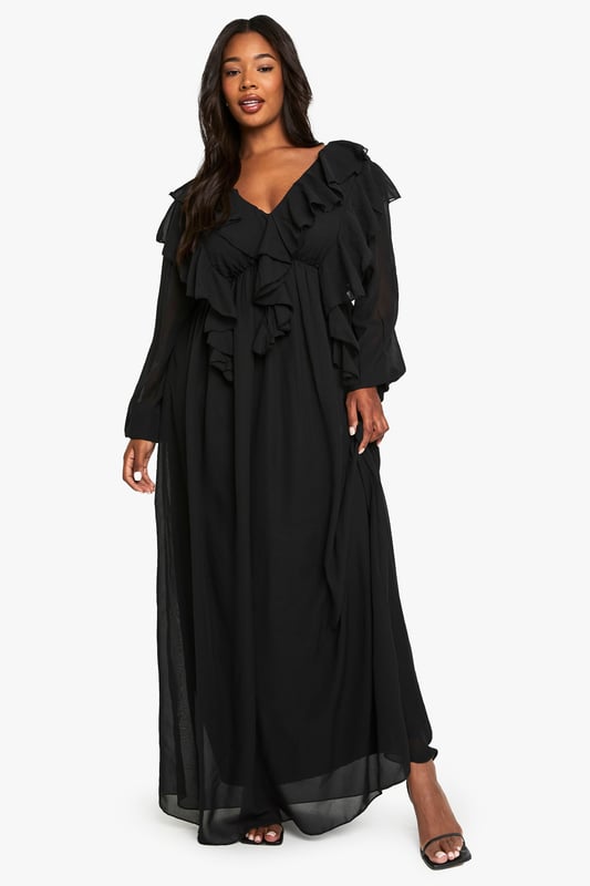 Flowing chiffon maxi-skater dress with dramatic ruffle detailing across the bodice
        Elegant V-neckline complemented by long, billowy sleeves for a romantic silhouette
        Flattering empire waistline that creates a feminine shape
        Striking open back design with delicate tie fastening
        Floor-sweeping length with gentle flare for graceful movement
    
    Make a captivating entrance at your next formal occasion in this enchanting chiffon maxi dress. The cascading ruffles create a sense of drama whilst the flowing skater silhouette ensures comfort throughout your event. Style with strappy heels and a compact clutch as seen on our model for a sophisticated evening ensemble. Perfect for weddings, formal dinners or graduation ceremonies, this dress offers versatility without compromising on elegance. The V-neckline frames the dcolletage beautifully, whilst the open back detail adds an unexpected twist to this otherwise classic piece. For cooler evenings, layer with a tailored blazer or delicate wrap to maintain the refined aesthetic whilst staying comfortable as you dance the night away.
