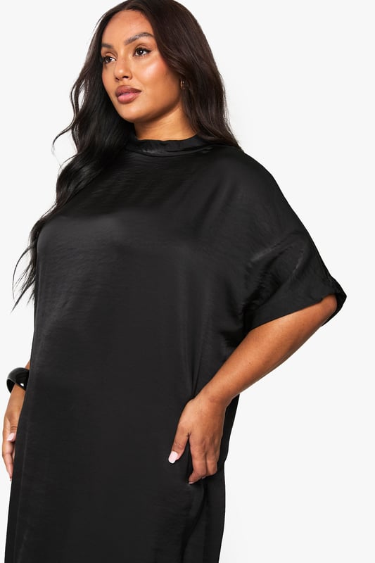 Luxurious satin finish that catches the light beautifully as you move
        Relaxed t-shirt style with short sleeves for effortless comfort
        Elegant midaxi length offering sophisticated coverage
        Clean, minimalist design perfect for accessorising to your taste
        Versatile silhouette that flatters curves with a gentle drape
    
    This satin midaxi t-shirt dress combines understated elegance with contemporary comfort. The relaxed fit skims your curves whilst the lustrous fabric adds a touch of glamour to your evening repertoire. Style with strappy heels and a compact handbag as seen on our model for a night out in the city. The simple design makes it ideal for showcasing statement jewellery - think bold earrings or layered necklaces to transform your look. For cooler evenings, throw on a cropped jacket or an oversized blazer. This dress transitions seamlessly from drinks with the girls to dancing the night away, offering both comfort and style that doesn't compromise on sophistication. The midaxi length strikes the perfect balance between allure and elegance, making this a true wardrobe hero for your going-out collection.