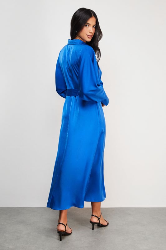 Striking batwing sleeves for a dramatic silhouette
        Elegant midi length with a daring side split
        Collared neckline adds a touch of sophistication
        Button-down front for versatile styling options
        Cinched waist design creates a flattering shape
    
    This satin shirt dress from Warehouse is a versatile piece that effortlessly transitions from day to night. The batwing sleeves create a bold, contemporary look, while the midi length with a side split adds a hint of allure. Perfect for confident women who appreciate edgy yet feminine styles, this dress can be styled for various casual occasions. For a chic daytime ensemble, pair it with ankle boots and a crossbody bag for a family lunch or weekend outing. Layer with a leather jacket for an edgier look when meeting friends for coffee. The button-down front allows for customisable coverage, making it suitable for different settings. Accessorise with statement earrings and a sleek updo for an evening dinner date. The dress's fluid silhouette and rich texture make it a standout piece in any wardrobe, ideal for those who want to make a subtle yet impactful fashion statement.