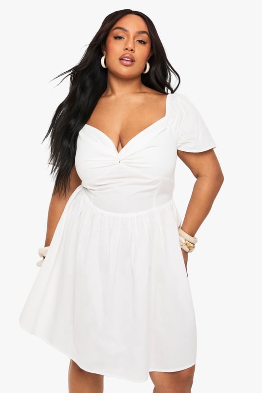 Flattering twist front detail creates a stunning sweetheart neckline
        Soft cotton blend fabric offers comfort and breathability
        Feminine cap sleeves provide just the right amount of coverage
        Classic skater silhouette with a fitted bodice and flared skirt
        Versatile design perfect for day-to-night styling
    
    This charming skater dress combines effortless style with a figure-flattering design. The twist front detail creates a beautiful neckline that draws the eye, whilst the fitted bodice and flared skirt work together to create a balanced silhouette. Style with simple flat sandals and stacked bangles for casual daytime events, or dress up with strappy heels and statement earrings for evening gatherings. The cotton blend fabric ensures this dress remains comfortable throughout the day, making it ideal for family barbecues, brunches with friends, or relaxed garden parties. Layer with a denim jacket when the temperature drops or wear alone to showcase the lovely cap sleeve detail. This Boohoo dress embodies casual chic that works for multiple occasions without compromising on style.