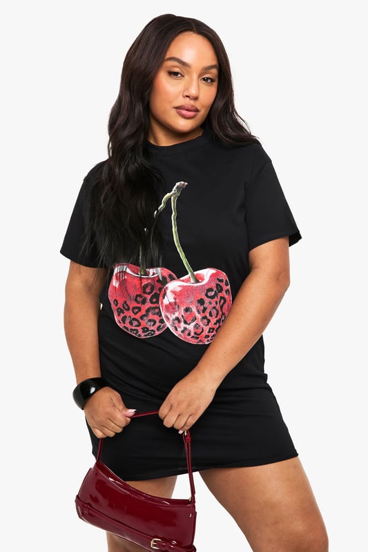 Oversized T-shirt dress with striking leopard print cherry graphic
        Comfortable cotton fabric for all-day wearability
        Relaxed short sleeve design with round neckline
        Mini length silhouette perfect for showcasing your legs
        Versatile piece that can be styled multiple ways for different occasions
    
    Make a bold statement with this playful oversized T-shirt dress from Boohoo. The eye-catching leopard print cherry graphic adds a touch of fun to this casual piece, whilst the relaxed fit ensures maximum comfort without compromising on style. Pair with chunky trainers and a crossbody bag for daytime outings as seen on our model, or dress it up with ankle boots and statement jewellery for evening drinks with the girls. The mini length is perfect for warmer days, but can easily transition into cooler weather when layered with tights and a leather jacket. This versatile dress works brilliantly for family gatherings, casual brunches, or weekend shopping trips - a true wardrobe essential that combines comfort with Boohoo's signature trendy aesthetic.