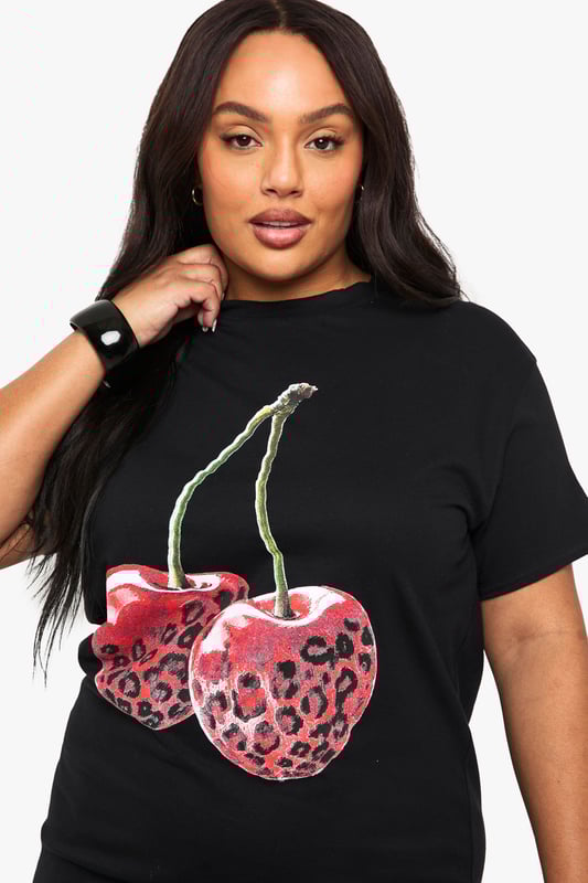 Oversized T-shirt dress with striking leopard print cherry graphic
        Comfortable cotton fabric for all-day wearability
        Relaxed short sleeve design with round neckline
        Mini length silhouette perfect for showcasing your legs
        Versatile piece that can be styled multiple ways for different occasions
    
    Make a bold statement with this playful oversized T-shirt dress from Boohoo. The eye-catching leopard print cherry graphic adds a touch of fun to this casual piece, whilst the relaxed fit ensures maximum comfort without compromising on style. Pair with chunky trainers and a crossbody bag for daytime outings as seen on our model, or dress it up with ankle boots and statement jewellery for evening drinks with the girls. The mini length is perfect for warmer days, but can easily transition into cooler weather when layered with tights and a leather jacket. This versatile dress works brilliantly for family gatherings, casual brunches, or weekend shopping trips - a true wardrobe essential that combines comfort with Boohoo's signature trendy aesthetic.