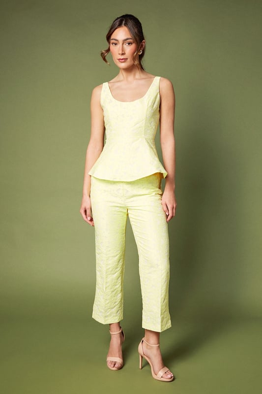 Elegant sleeveless design with sophisticated jacquard texture
        Flattering peplum silhouette that accentuates the waistline
        Refined square neckline for a contemporary touch
        Structured bodice with subtle shaping for a polished look
        Fully lined for comfort and a smooth finish
    
    This exquisite jacquard peplum top from Coast embodies refined elegance for your special occasions. The structured bodice with its contemporary square neckline creates a flattering frame for your dcolletage, whilst the peplum detail gracefully highlights the waist for a feminine silhouette. As shown, pair with coordinating trousers for a sophisticated co-ord ensemble perfect for summer weddings or race day events. Alternatively, style with a tailored pencil skirt and strappy heels for evening soires. Complete your look with delicate jewellery and a clutch bag for occasions where making an impression matters. The versatile design transitions beautifully from formal daytime events to elegant evening gatherings, making it a valuable addition to your occasion wardrobe.