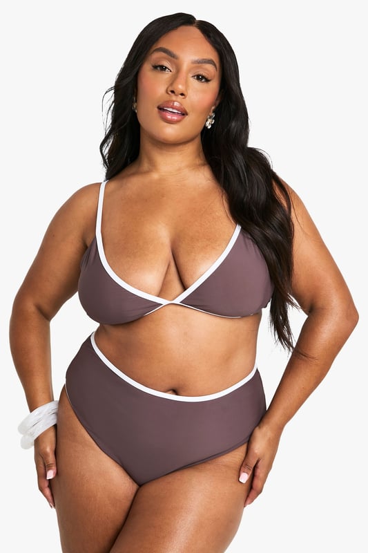 Balconette style bikini top with flattering lift and support
        Contrasting trim detail along edges for a striking visual effect
        Adjustable shoulder straps with gold-tone hardware for a customised fit
        Deep V-neckline creates an elegant silhouette
        High-waisted matching bottoms complete the coordinated set
    
    Make a statement poolside with this Plus Kontrast Balconette Bikini Top from Boohoo. The sophisticated balconette design offers excellent support whilst creating a beautifully defined shape. The contrasting trim adds a contemporary twist to this classic swimwear piece, making it perfect for those who want to stand out at the beach club. Pair with the matching high-waisted bottoms for a cohesive look, or mix with plain bottoms for versatility. This bikini is ideal for everything from lounging by the pool to beach volleyball with friends. Add oversized sunglasses and a wide-brimmed hat for ultimate holiday glamour, or layer under a sheer kaftan when heading to beachside lunch. The adjustable straps ensure comfort throughout the day, no matter your activity of choice.