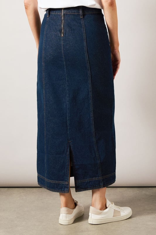 Striking midaxi length denim skirt with distinctive vertical seam detailing
        Front button-through design with metal buttons for a classic denim aesthetic
        Practical side pockets perfect for everyday essentials
        Flattering A-line silhouette that gently flares from the waist
        Subtle back slit detail for ease of movement and added comfort
    
    This sophisticated Seam Detail Midaxi Denim Skirt from Wallis combines timeless style with contemporary design. The vertical seam detailing creates a slimming effect while the classic button-through front adds a touch of casual charm. Style with a simple white t-shirt and leather sandals for relaxed weekend brunches, or pair with a tucked-in blouse and ballet flats for family gatherings. The versatile midaxi length works beautifully for various daytime occasions, from shopping trips to casual lunch dates. For cooler days, layer with a lightweight jumper and trainers for an effortlessly chic look. The cotton fabric provides breathable comfort throughout the day, while the practical pockets add functionality to this wardrobe staple. This skirt transitions seamlessly from season to season, making it a truly versatile addition to your casual collection.
