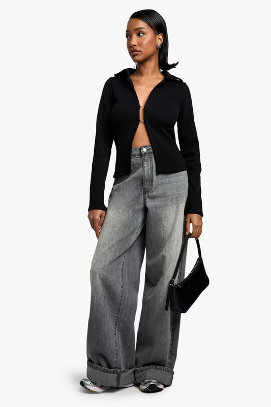 Chic collared long-sleeve top
        Fitted silhouette for a flattering shape
        Versatile open-front design
        Ribbed texture for added interest
        Cropped length to accentuate the waist
    
    This long-sleeved collared top from Boohoo is the perfect blend of sophistication and edge. The fitted silhouette hugs your curves, while the open front design allows for endless styling possibilities. Pair it with high-waisted wide-leg jeans and trainers for a casual day out, or dress it up with a sleek midi skirt and heels for a night on the town. The ribbed texture adds a touch of intrigue, making it stand out from your average top. Its versatility shines through as it can be worn open as a lightweight jacket or closed for a more polished look. The cropped length is ideal for highlighting your waistline and works brilliantly with high-rise bottoms. Whether you're heading to a family gathering or meeting friends for brunch, this top will keep you looking effortlessly stylish.