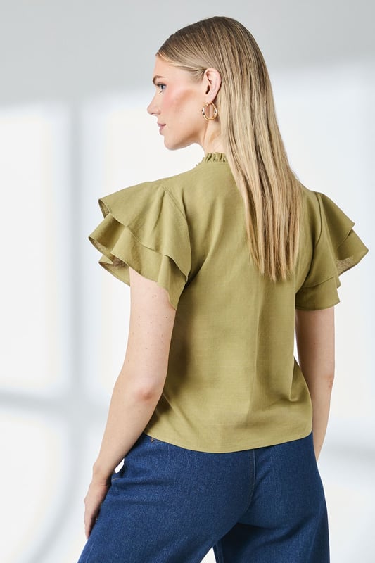 Charming bubble hem design creates a flattering silhouette
        Feminine flute sleeves with delicate ruffle detail
        Elegant V-neckline with tie detail for adjustable styling
        Gathered neckline adds texture and visual interest
        Regular fit in soft cotton-blend fabric for all-day comfort
    
    This Principles top combines playful elements with everyday wearability. The distinctive bubble hem creates a relaxed shape that skims the body beautifully, whilst the flute sleeves add a touch of feminine flair. Style with your favourite denim jeans and trainers for weekend brunches, or dress up with tailored trousers and ballet flats for casual office days. The versatile design works brilliantly for family gatherings and informal social occasions - simply add statement earrings and a crossbody bag to complete the look. The cotton-blend fabric ensures breathability and comfort throughout the day, making this top a practical yet stylish addition to your daywear collection. Perfect for the transitional seasons when layered under a lightweight cardigan or denim jacket.
