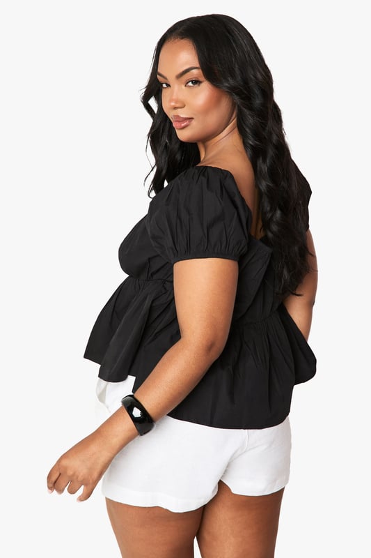 Flattering Bardot neckline with elegant ruched detailing
        Soft cotton fabric for all-day comfort
        Feminine puff sleeves with elasticated cuffs
        Gathered peplum hem creating a figure-enhancing silhouette
        Versatile design that can be worn on or off the shoulder
    
    This charming ruched Bardot top from Boohoo combines casual comfort with effortless style. The gathered detailing across the neckline creates a feminine look whilst the peplum hem adds a flattering shape to your silhouette. Style with white shorts and flat sandals for daytime outings as shown, or dress up with your favourite denim jeans and trainers for casual drinks with friends. The cotton fabric ensures breathability for those warmer days, whilst the elasticated elements provide a comfortable fit that moves with you. Perfect for family gatherings or weekend brunches, this top offers versatility for your everyday wardrobe. Add simple jewellery and a crossbody bag to complete this relaxed yet put-together look.