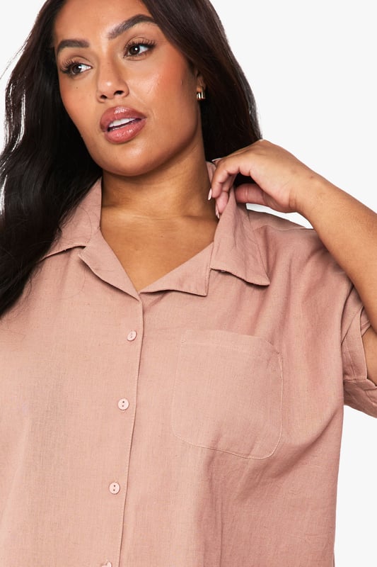 Relaxed linen-look co-ord featuring a short-sleeved shirt with classic collar and button-through front
        Comfortable shorts with elastic waistband for easy wear and perfect fit
        Practical chest pocket detail on the shirt adds a touch of casual sophistication
        Versatile two-piece set that can be worn together or styled separately
        Breathable fabric ideal for warm weather and holiday packing
    
    This effortlessly chic linen-look co-ord is your warm-weather wardrobe essential. The breezy short-sleeved shirt with its relaxed fit pairs perfectly with the comfortable elastic-waist shorts for a coordinated look that requires minimal effort. Style with trainers and a woven tote bag for casual daytime outings, or dress up with leather sandals and delicate jewellery for family gatherings and brunches with friends. The versatility of this set cannot be overstated - wear together for an instantly put-together appearance or mix with other wardrobe staples for multiple outfit options. The breathable fabric makes this an ideal choice for city breaks, beach holidays or simply lounging at home when temperatures rise. A true capsule wardrobe hero that combines comfort and style in equal measure.