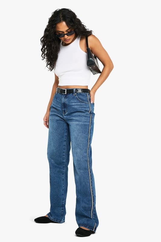 Straight leg jeans with eye-catching side stripe detail
        High-rise waist for a flattering silhouette
        Classic five-pocket design for practicality
        Belt loops for versatile styling options
        Comfortable cotton-blend fabric for all-day wear
    
    Make a statement with these trendy straight leg jeans from Boohoo. The standout side stripe adds a contemporary twist to a timeless denim staple, perfect for the fashion-forward woman who loves to stay ahead of the curve. Pair these jeans with a cropped vest top and trainers for a casual daytime look that's both comfortable and stylish. For a more polished ensemble, team with a crisp white shirt and ankle boots. The versatile design makes these jeans suitable for various casual occasions, from coffee dates with friends to family gatherings. The high-rise waist and straight leg cut create a flattering silhouette that complements a range of body types, embodying Boohoo's commitment to inclusivity. Embrace your individuality and make these jeans the cornerstone of your casual wardrobe.