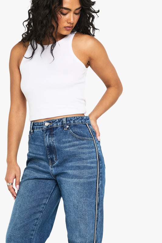 Straight leg jeans with eye-catching side stripe detail
        High-rise waist for a flattering silhouette
        Classic five-pocket design for practicality
        Belt loops for versatile styling options
        Comfortable cotton-blend fabric for all-day wear
    
    Make a statement with these trendy straight leg jeans from Boohoo. The standout side stripe adds a contemporary twist to a timeless denim staple, perfect for the fashion-forward woman who loves to stay ahead of the curve. Pair these jeans with a cropped vest top and trainers for a casual daytime look that's both comfortable and stylish. For a more polished ensemble, team with a crisp white shirt and ankle boots. The versatile design makes these jeans suitable for various casual occasions, from coffee dates with friends to family gatherings. The high-rise waist and straight leg cut create a flattering silhouette that complements a range of body types, embodying Boohoo's commitment to inclusivity. Embrace your individuality and make these jeans the cornerstone of your casual wardrobe.