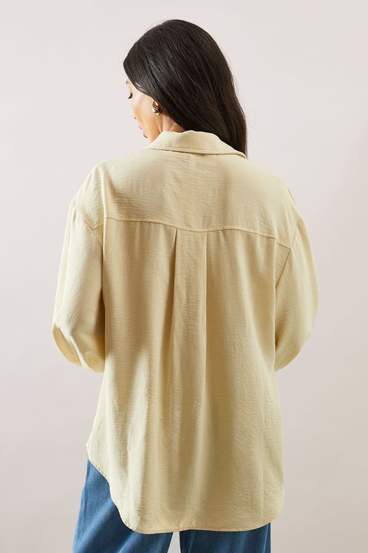 Pocket Detail Relaxed Collared Shirt Relaxed fit collared shirt with elegant chest pocket detail
Voluminous balloon sleeves with fitted cuffs for a feminine silhouette
Soft woven fabric with slight stretch for all-day comfort
Classic button-through front with sophisticated collar design
Curved hem perfect for both tucked or untucked styling options
This versatile Wallis shirt combines sophistication with everyday comfort. The relaxed silhouette drapes beautifully over the body while the distinctive pocket detail adds a touch of refinement. Style it as shown with wide-leg denim trousers and trainers for a polished daytime look, or tuck the front into tailored trousers for family gatherings. The balloon sleeves create a contemporary shape that transitions effortlessly from office to weekend brunch. For cooler days, layer under a lightweight cardigan or pair with your favourite jeans and ankle boots. The collared neckline frames the face beautifully, making this shirt an essential addition to your daywear collection - perfect for those occasions when you want to feel put-together yet comfortable.