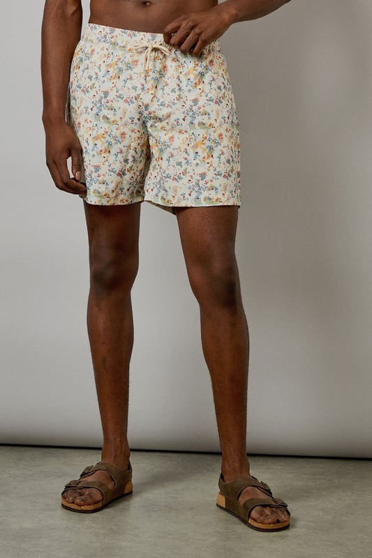 Distinctive sunset camo print swim shorts with a relaxed mid-thigh length
        Comfortable elasticated waistband with adjustable drawstring for a secure fit
        Quick-drying fabric ideal for beach days and poolside lounging
        Versatile design suitable for both swimming and casual summer wear
        Relaxed fit allowing for ease of movement during activities
    
    These Burton swim shorts showcase a distinctive sunset camo print that brings a subtle touch of personality to your summer wardrobe. Perfect for the man who appreciates classic style with a contemporary twist, these shorts transition effortlessly from beach to bar. Pair them with a simple white tee and leather sandals for a relaxed daytime look, or throw on a linen shirt for evening drinks by the sea. The mid-thigh length offers a flattering silhouette without restricting movement, making them ideal for everything from a casual swim to a game of beach volleyball with mates. Comfortable enough for all-day wear during family barbecues or festival weekends, these shorts reflect the practical yet stylish ethos that Burton is known for. Machine washable for easy care, they'll quickly become your go-to for summer adventures and holiday packing.