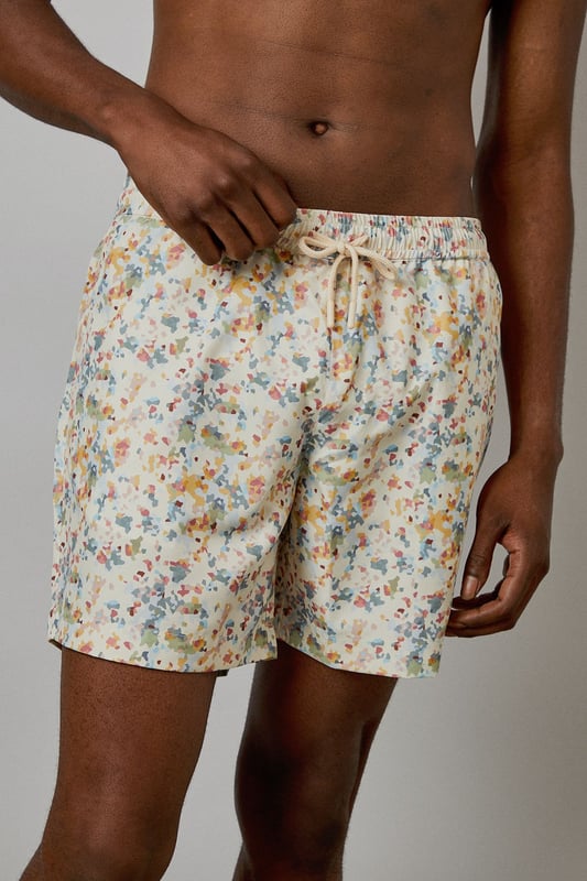 Distinctive sunset camo print swim shorts with a relaxed mid-thigh length
        Comfortable elasticated waistband with adjustable drawstring for a secure fit
        Quick-drying fabric ideal for beach days and poolside lounging
        Versatile design suitable for both swimming and casual summer wear
        Relaxed fit allowing for ease of movement during activities
    
    These Burton swim shorts showcase a distinctive sunset camo print that brings a subtle touch of personality to your summer wardrobe. Perfect for the man who appreciates classic style with a contemporary twist, these shorts transition effortlessly from beach to bar. Pair them with a simple white tee and leather sandals for a relaxed daytime look, or throw on a linen shirt for evening drinks by the sea. The mid-thigh length offers a flattering silhouette without restricting movement, making them ideal for everything from a casual swim to a game of beach volleyball with mates. Comfortable enough for all-day wear during family barbecues or festival weekends, these shorts reflect the practical yet stylish ethos that Burton is known for. Machine washable for easy care, they'll quickly become your go-to for summer adventures and holiday packing.