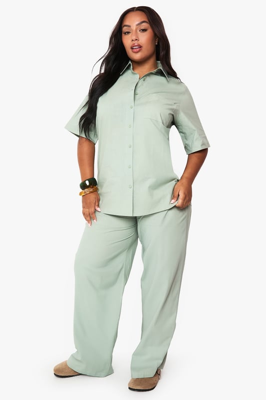 Cotton fabric provides breathable comfort for all-day wear
        Wide leg design offers a relaxed, flowing silhouette
        Elasticated waistband ensures a comfortable, adjustable fit
        Plus size tailoring designed specifically for curvier figures
        Versatile trousers that transition effortlessly from day to evening
    
    These wide leg cotton trousers from Boohoo deliver both comfort and contemporary style for the fashion-forward woman. The relaxed silhouette creates a flattering drape that moves beautifully with every step, whilst the soft cotton fabric ensures breathability throughout the day. Style them as shown with a matching button-up shirt for a coordinated set that projects confidence and sophistication. For casual outings, pair with trainers and a cropped tee, or dress them up for family gatherings with a fitted blouse and statement jewellery. The versatile design works brilliantly with both fitted and oversized tops, making these trousers a wardrobe essential that can be styled countless ways. Perfect for those seeking comfort without compromising on style.