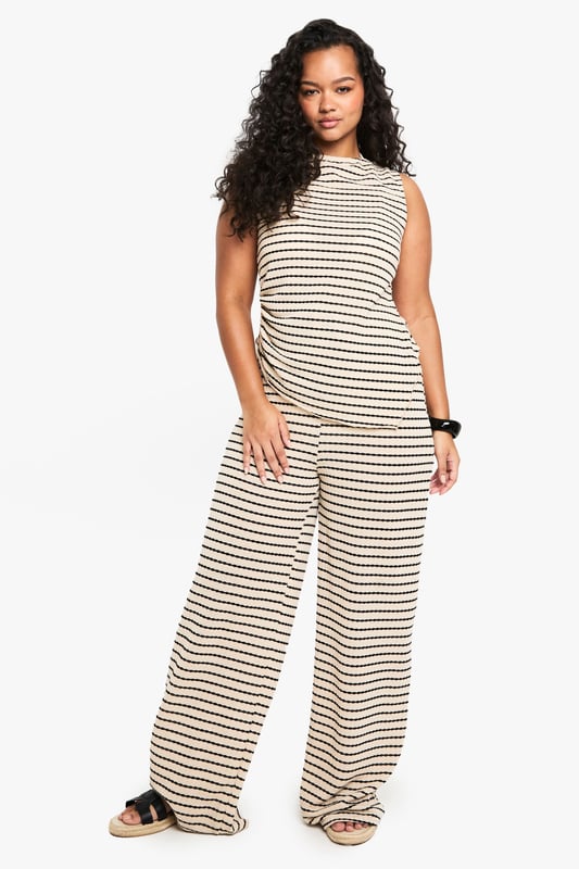 Striking striped pattern for a bold, eye-catching look
        Wide-leg silhouette offers comfort and style
        High-waisted design with drawstring for adjustable fit
        Soft jersey fabric ensures all-day comfort
        Versatile piece suitable for various casual occasions
    
    Make a statement with these trendy wide-leg trousers, perfect for the fashion-forward woman who values both style and comfort. The eye-catching striped pattern adds a touch of flair to your ensemble, while the relaxed wide-leg cut ensures ease of movement. Pair these trousers with a cropped top and oversized sunglasses for a chic daytime look, or dress them up with a fitted blouse and statement jewellery for a casual evening out. The high-waisted design with an adjustable drawstring allows for a customised fit, making these trousers suitable for a range of body types. Ideal for family gatherings, brunches with friends, or a day of shopping, these versatile trousers will quickly become a staple in your wardrobe. The soft jersey fabric promises comfort throughout the day, whether you're running errands or lounging at home. Complete the look with flat sandals or trainers for an effortlessly cool vibe that embodies the Boohoo spirit.